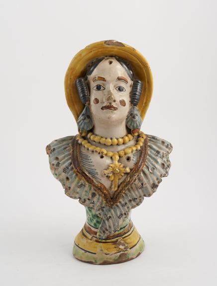 Tin glaze polychrome bottle in the shape of a female bust