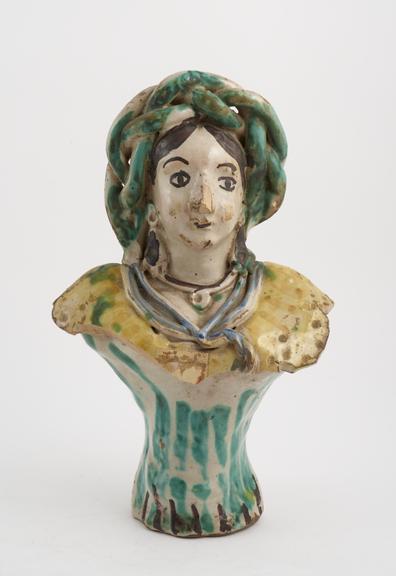 Tin glaze polychrome bottle in the shape of a female bust