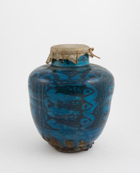 Pottery drug jar, ovoid body, parchment cover, possibly Persian