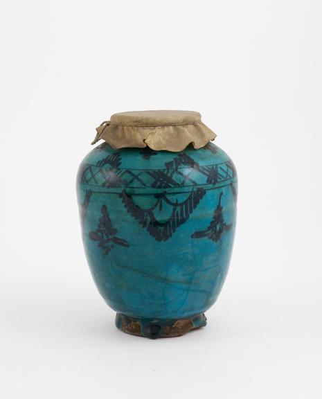 Pottery drug jar, bluish green, ovoid, with  parchment cover