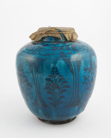 Pottery drug jar, bluish green, ovoid, with parchment cover