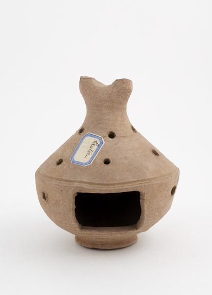 Pottery vessel, perforated with several small holes