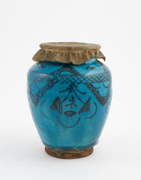 Pottery drug jar, ovoid body, with parchment cover