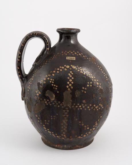 Large brown earthenware, slipware jug, possibly German