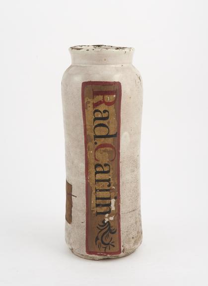 Tin-glazed earthenware albarello, labelled RAD CARLIN'
