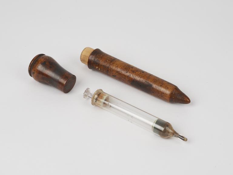 Rectal syringe(?), glass, in wooden case, 19th century