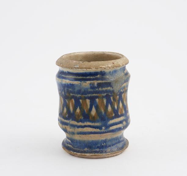 Tin-glazed earthenware dispensing pot, a miniature albarello