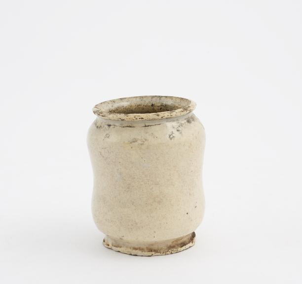 Tin-glazed earthenware dispensing pot, a miniature albarello