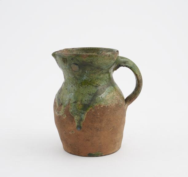 Earthenware jug, with green glaze, possibly medieval