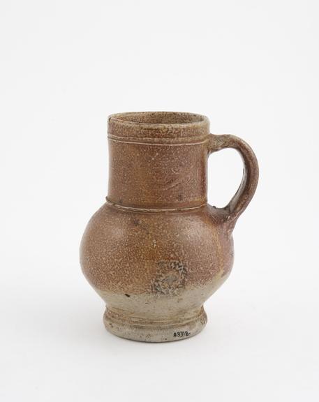 Stoneware jug, bulbous with wide cylindrical neck and vertical