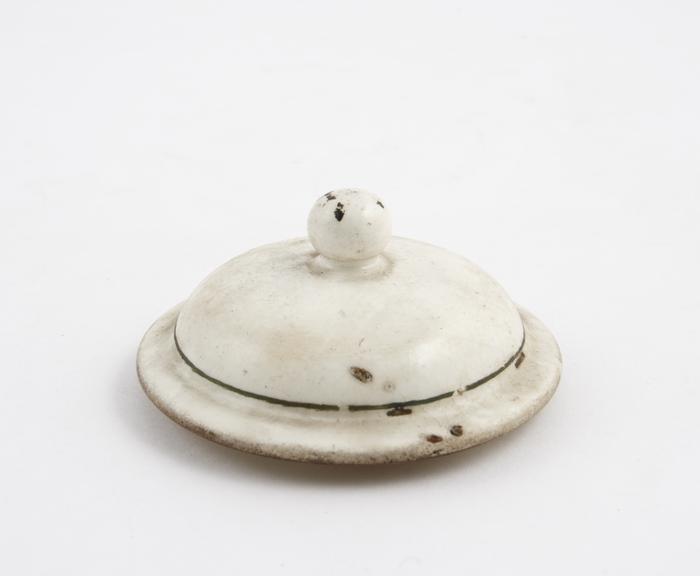 Tin glazed earthenware lid from a drug jar, white