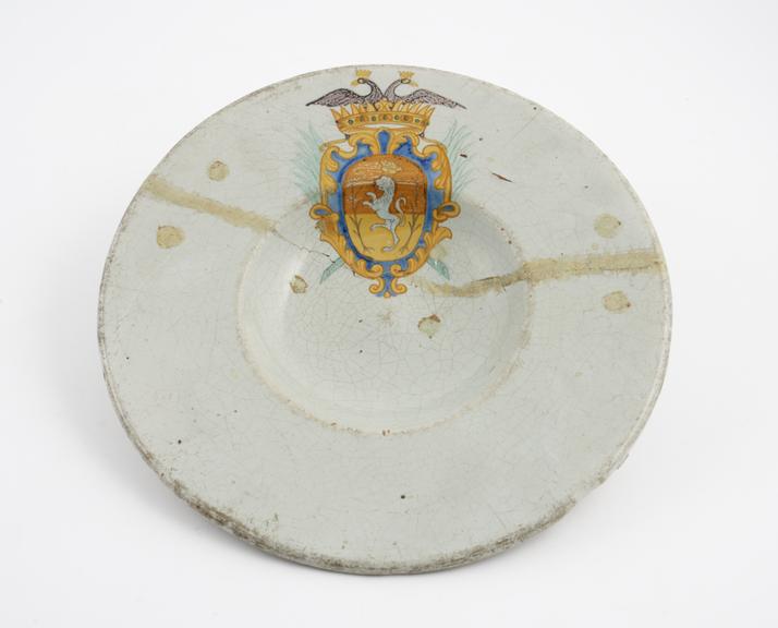 Tin-glazed earthenware plate, painted with an arms