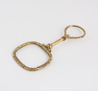 Spectacles, hand, ornate gilt metal quizzer