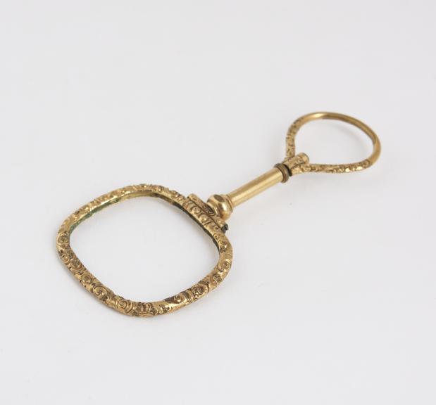 Spectacles, hand, ornate gilt metal quizzer, lens missing