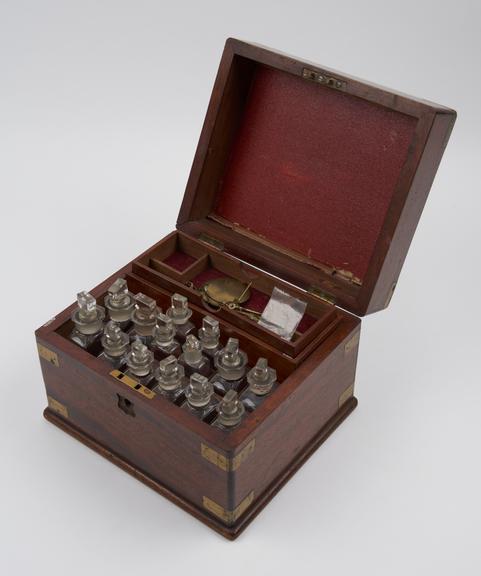 Brass bound mahogany medicine chest with 18 unlabelled glass