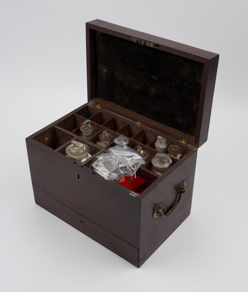 Medicine chest, mahogany, with 10 glass bottles, all labelled