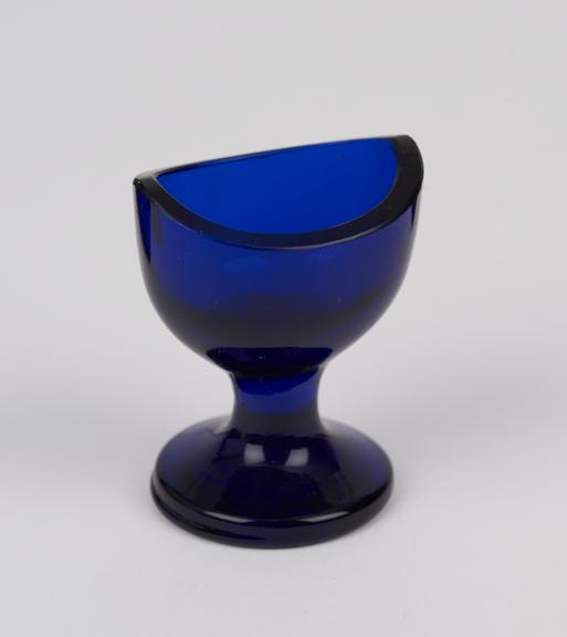 Glass eye-bath, blue with stem, blown, European, 1851-1920