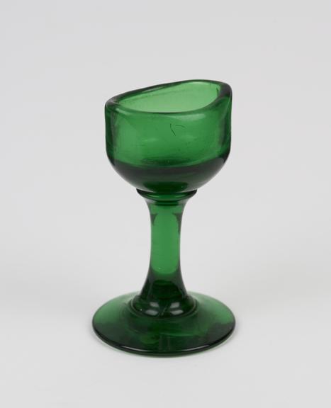 Glass eye bath, green, with stem, blown, European, 1851-1920