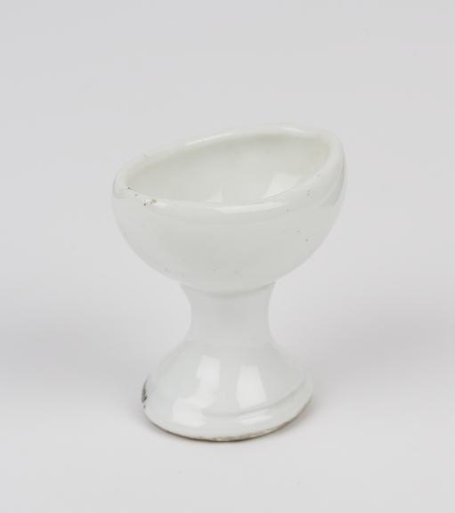 Porcelain eye bath, with stem, probably English