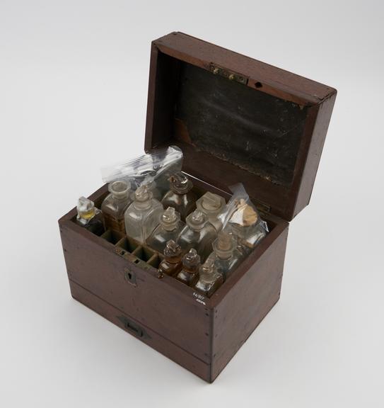 Medicine chest with twenty-one bottles (18 labelled)