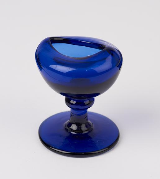 Blue glass eye-bath, blown and with stem probably English