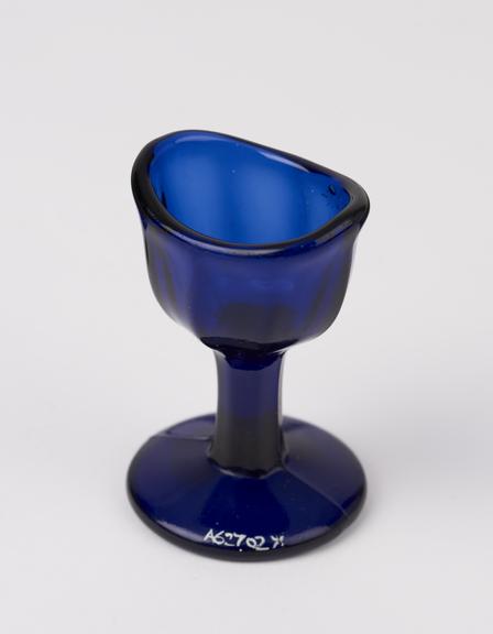 Glass eye bath, blue, with stem, European, moulded, 19th century