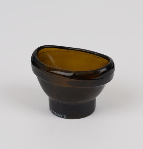 Glass eye bath, brown without stem, moulded