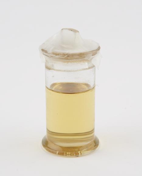 Glass specimen jar, containing carbolic acid and olive oil