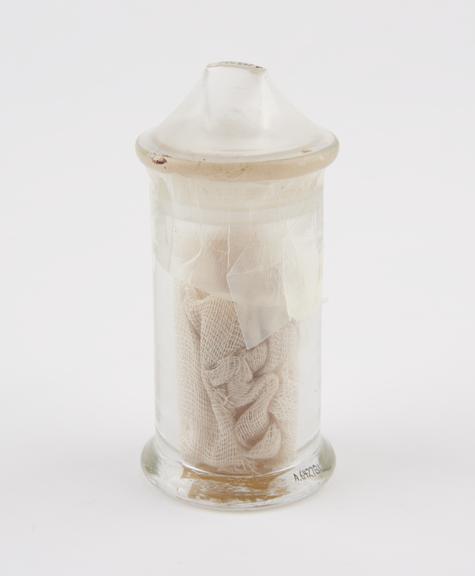 Glass specimen jar, full of sero-sublimate impregnated gauze