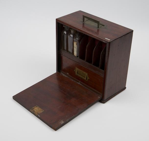 Mahogany medicine chest with hinged locking flaps front and