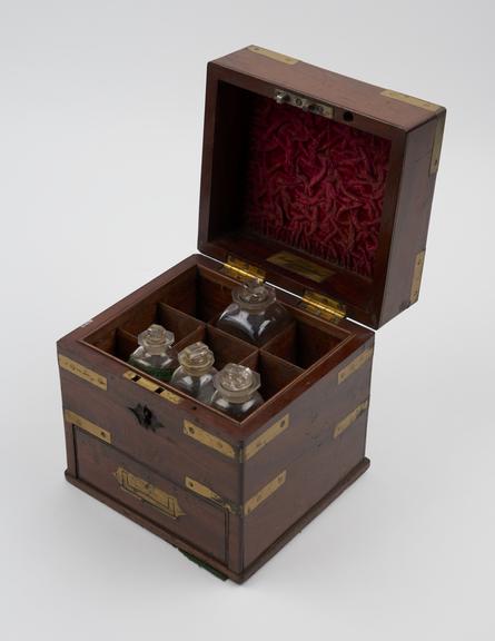 Brass bound mahogany medicine chest, only half full