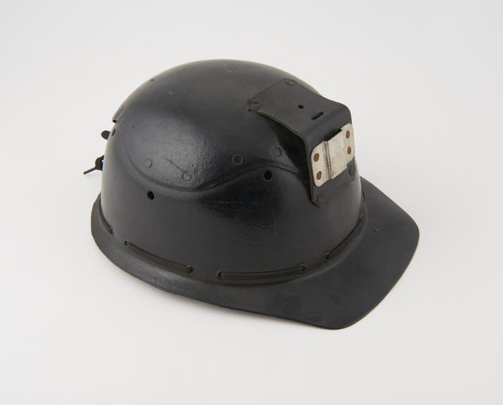 Miner's helmet, one of seven