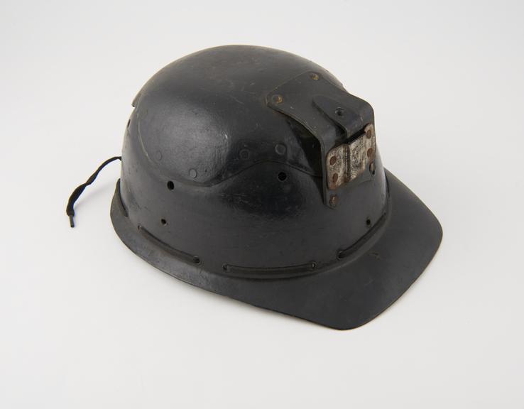 Miner's helmet, one of seven