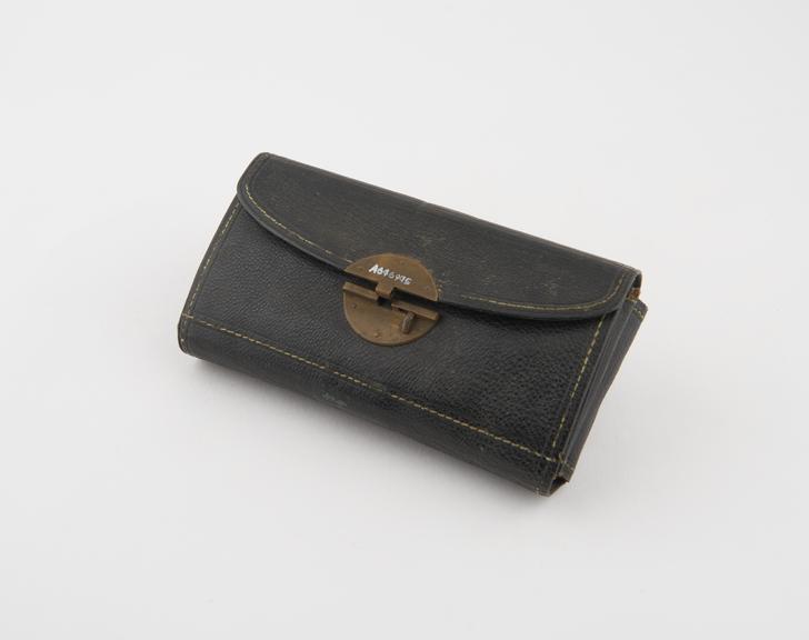 Pocket surgical instrument set in folding leather case