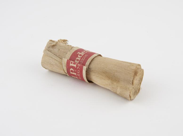 Roll of crepe bandage with paper ring, German, 1900-1920