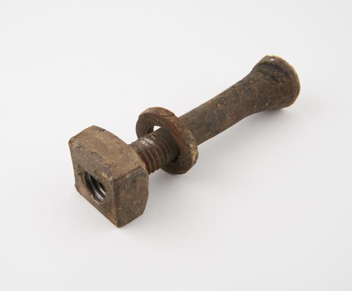 Bolt with nut, part of two bays of floor beams