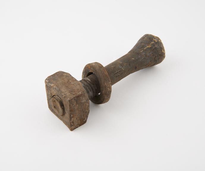 Bolt with nut, part of two bays of floor beams