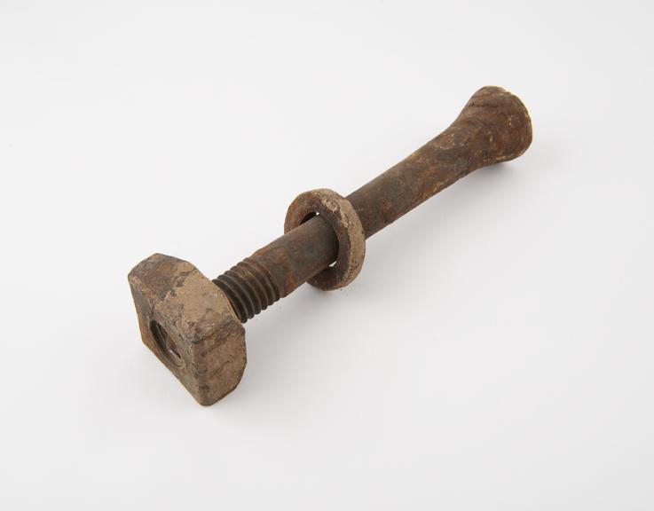 Bolt with nut, part of two bays of floor beams