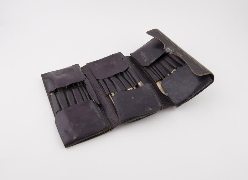 Pocket surgical instrument set, in folding leather case