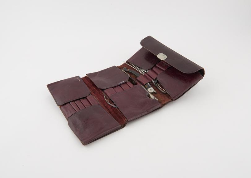 Pocket surgical instrument set in leather wallet