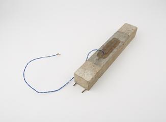 rectangular concrete bar with attached wires, part of micro concrete models