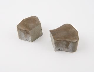 Briquette of neat cement for testing