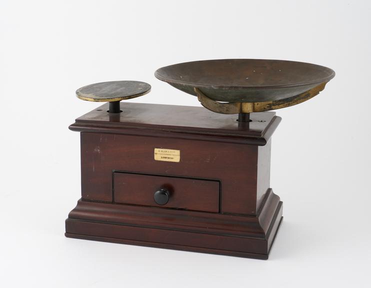 Pair of scales mounted on mahogany box