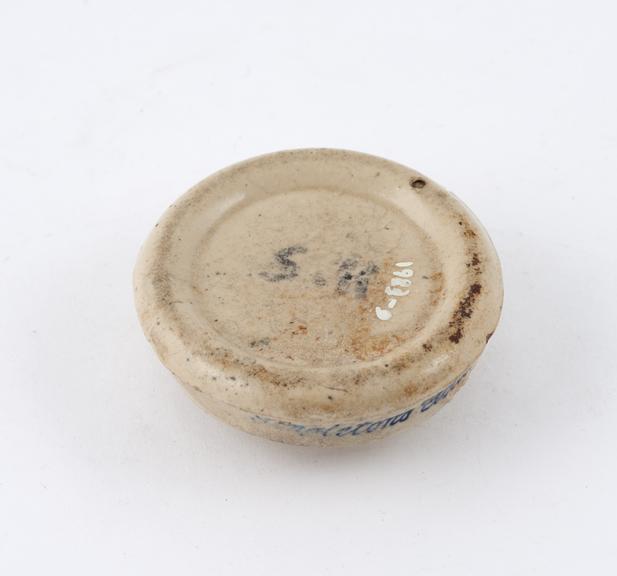 Stoneware ointment jar lid marked Singleton's Golden Eye