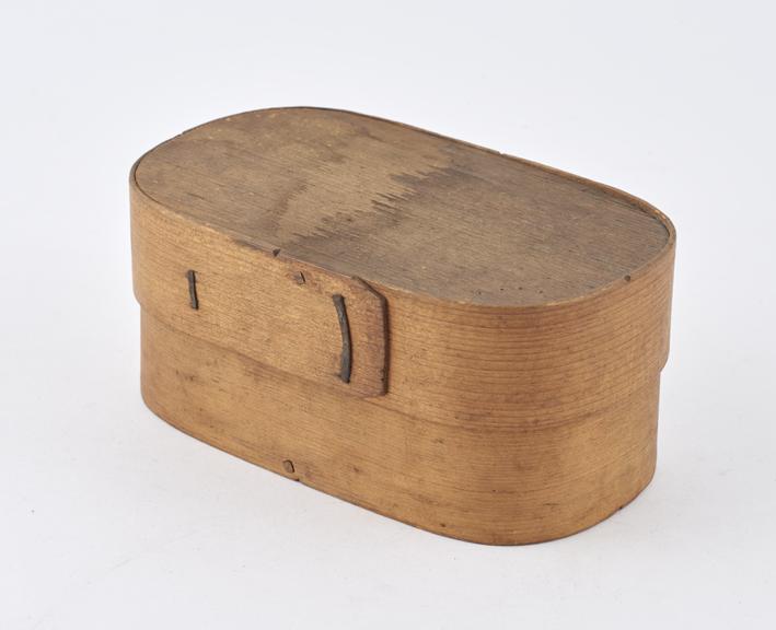 Oblong wooden herb box with rounded ends and lid