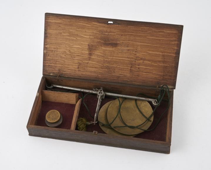 Set of apothecaries' scales, brass pans and steel beam