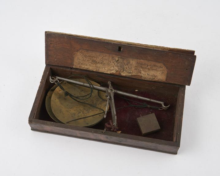 Apothecaries' scales with brass pans and steel beam in