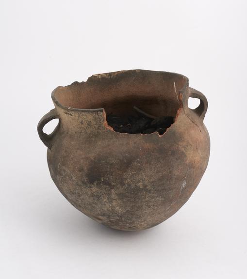 Unglazed earthenware pot fitted with lugs either side