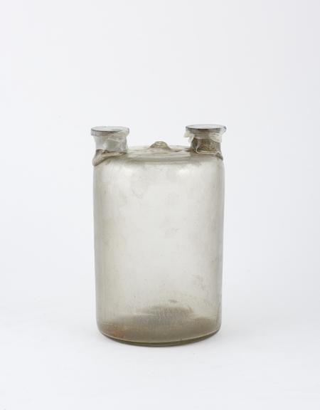 Clear glass woulfe bottle, cylindrical, with two tubulares