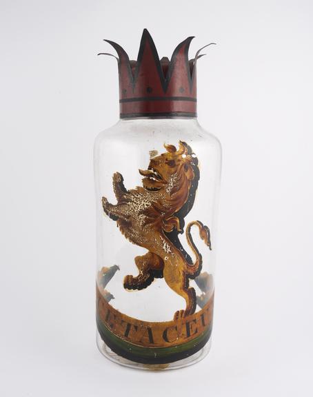 Glass specie jar, with metal crown lid, labelled Cetaceum''